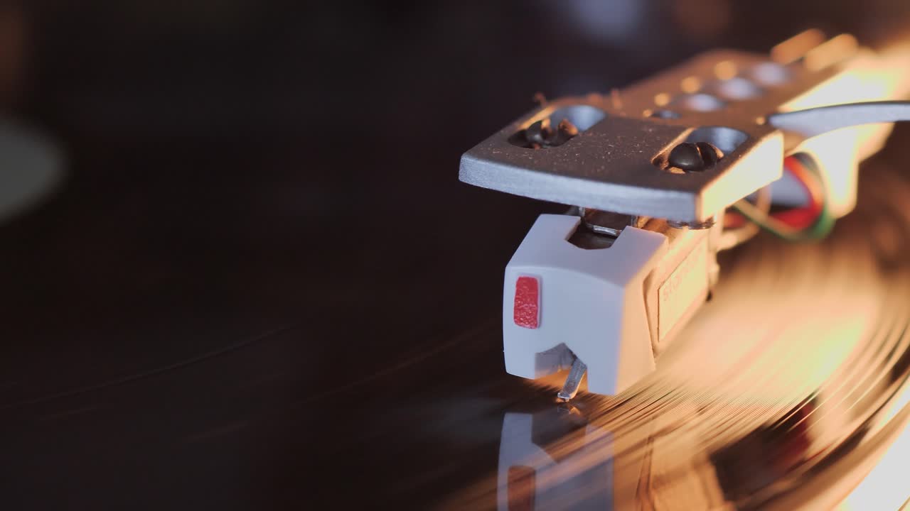 Playing a vinyl record - extreme close-up macro shot, cartridge and stylus. Scene C