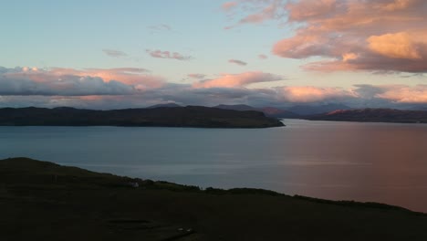 panning golden hour drone shot of scottish coastline