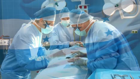 Animation-of-flag-of-honduras-waving-over-surgeons-in-operating-theatre