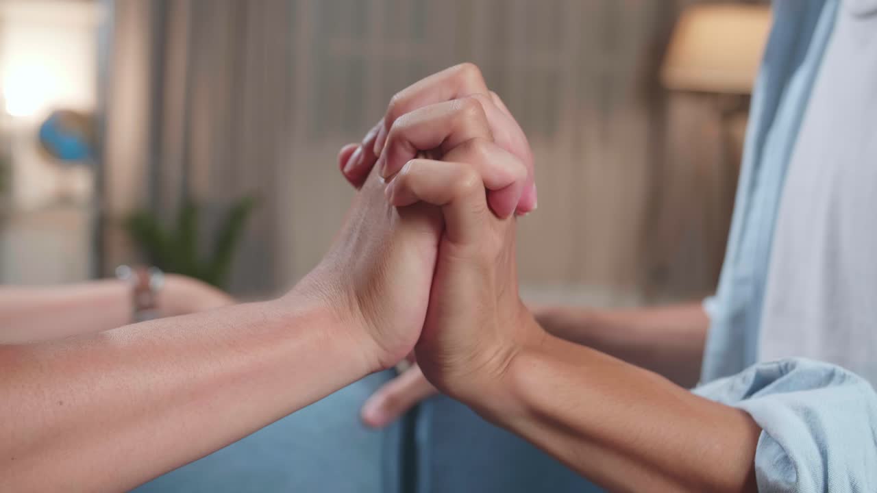 Authentic Close Up Footage Of A Young Adult Gay Couple Holding Hands And Spend Time At Home. Lgbt Relationship