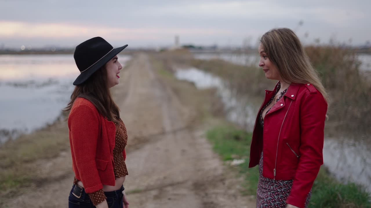 Two women arguing outdoors