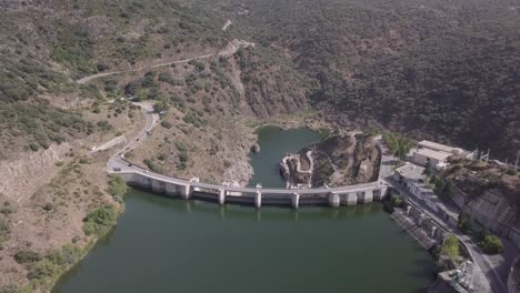 drone shot of water dam reservoir in the mountains