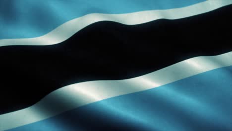 botswanas flagge, die im wind weht. staatsflagge von botswana. zeichen von botswana nahtlose schleife-animation. 4k