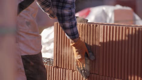 close-up-of-brick-put-in-place-on-cement