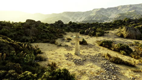 exploring a mystical stone statue in a rugged landscape during daylight