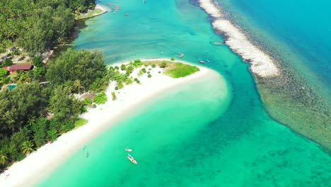 great coral reefs barrier protecting calm clear water of turquoise lagoon washing gently white sand of beautiful beach in thailand