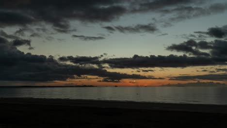 sunset on horizon at wailoaloa beach in fiji, nightfall on tropical island, timelapse