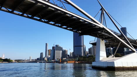 brisbane city cat sails under bridge view from stern early morning