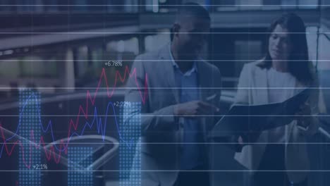 animation of financial graphs and data over diverse female and male coworkers in office