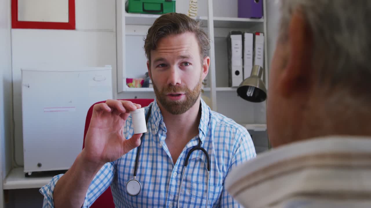 Doctor examining a senior man in a retirement home