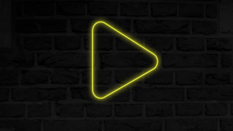 animación del icono del botón de reproducción de neón brillante en la pared de ladrillo