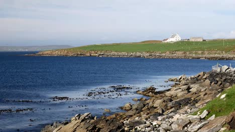 wide shot of a remote, isolated bay in shetland, scotland, uk