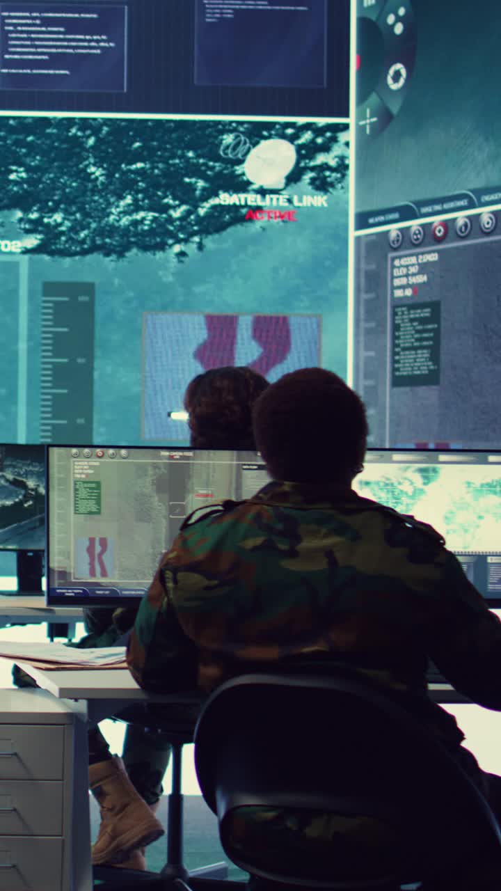 Military Personnel Monitoring Satellite Surveillance in High-Tech Control Room