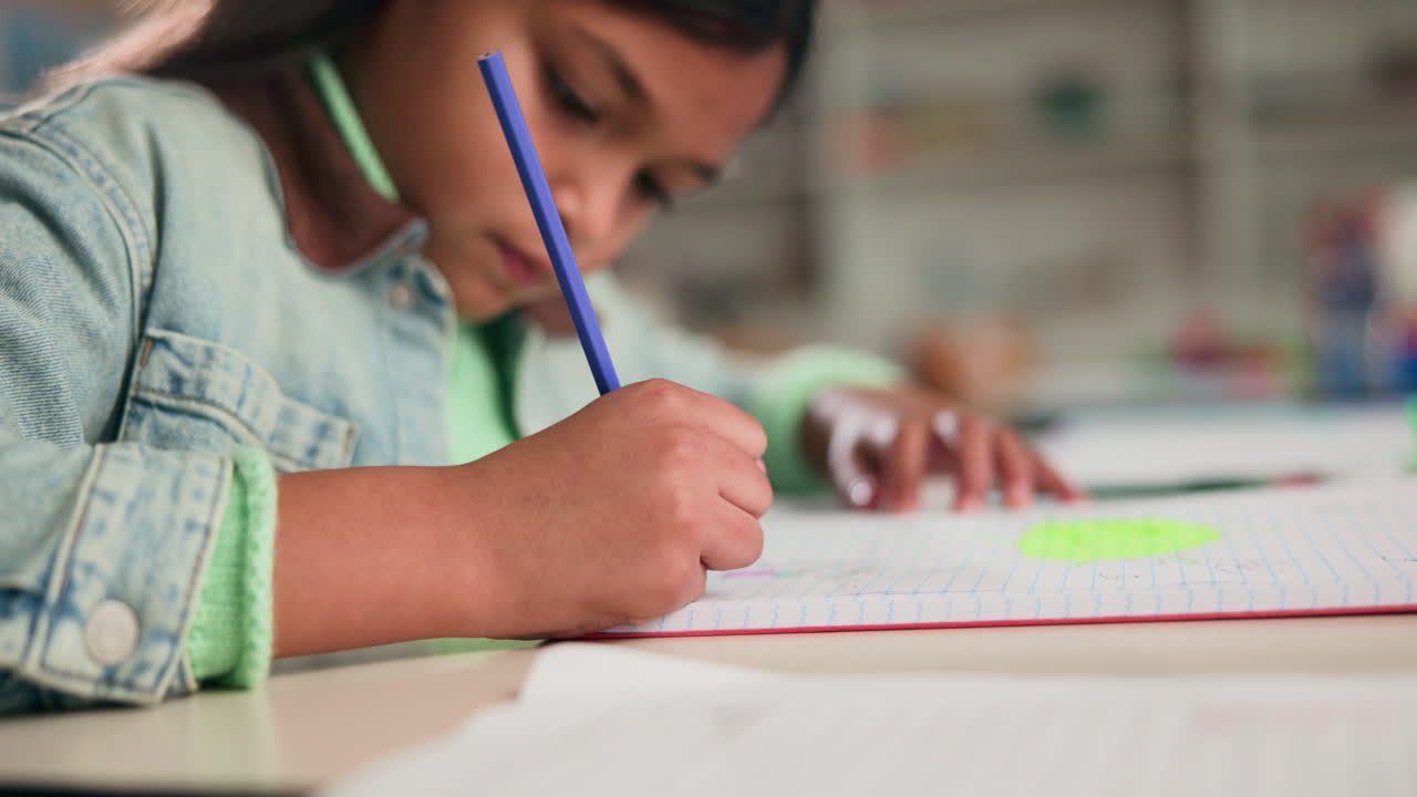 A child drawing in a notebook at school