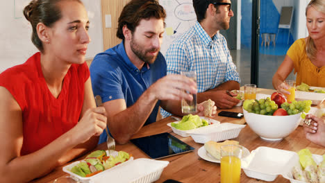 Businesspeople-having-meal-together