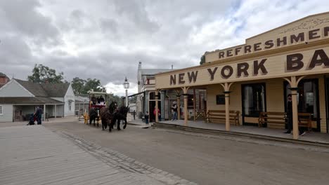 horse-drawn carriage passing by new york bakery