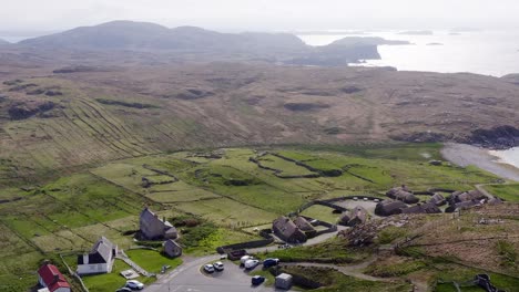 Wide-angle-drone-shot-of-the-Gearrannan-Blackhouse-Village-on-the-Isle-of-Lewis,-part-of-the-Outer-Hebrides-of-Scotland