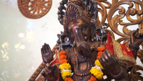 ganpati-statue-of-Indian-god-dark-stone-slow-motion