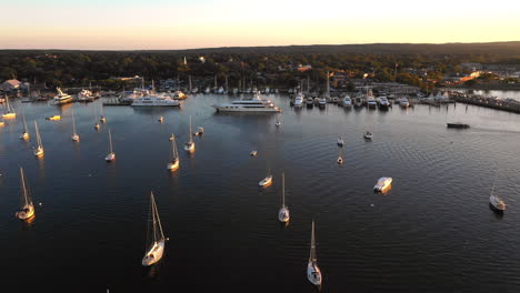 sunset aerial view, boats in harbour at the hamptons, new york