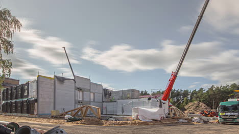 timelapse shot of a cranes arranging white colored containers throughout the day