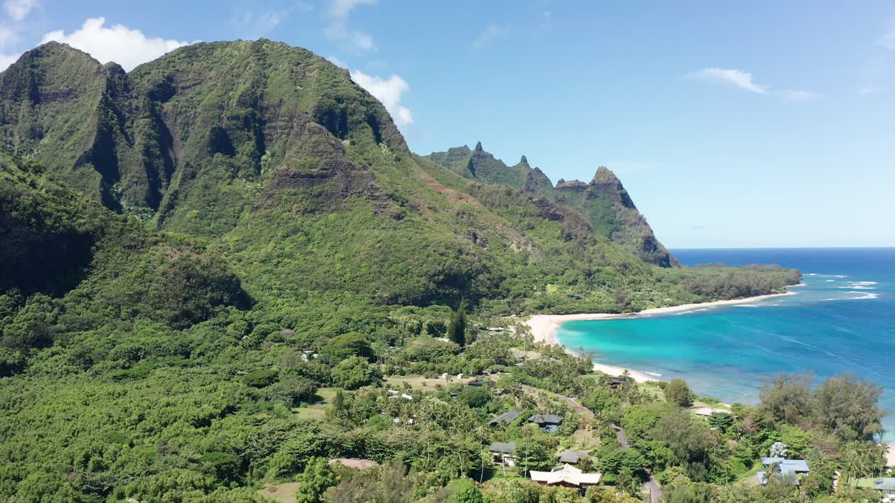 Wide rising aerial shot of beautiful Haena Beach on the Hawaiian island of Kaua'i