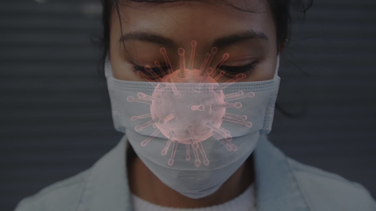 Animation of covid 19 cells moving over woman in face mask