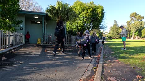 kids walking towards school building in melbourne