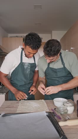 two men baking in the kitchen
