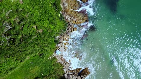 Aerial-Top-View-of-Ocean-Waves-Reaching-Beach-Shore