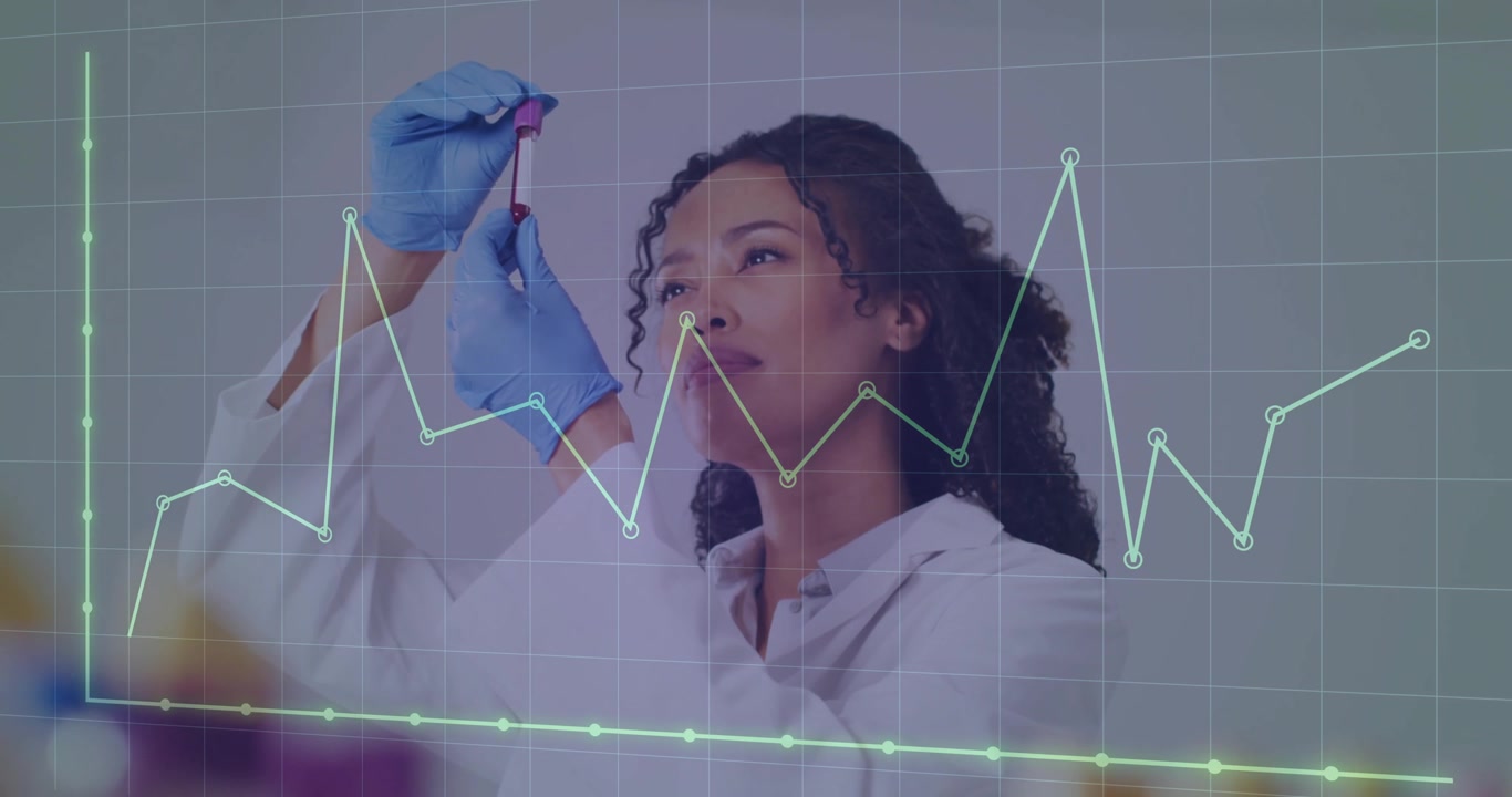 Gloved lab technician holding blood sample tube in medical lab while analyzing with graph overlays