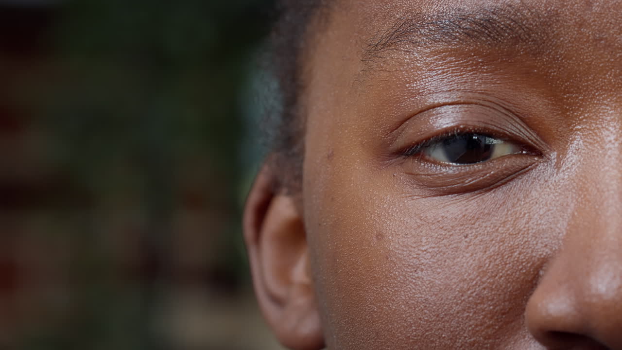 Macro shot of young adult smiling and looking at camera