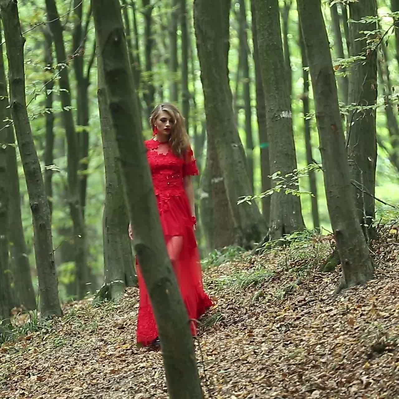 Beautiful Woman Walking Through Green Forest