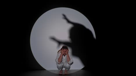 person confronting inner shadow in dramatic lighting