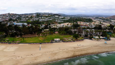 aerial view of a scenic coastal town and beach