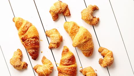 Various-croissants-lying-on-table-
