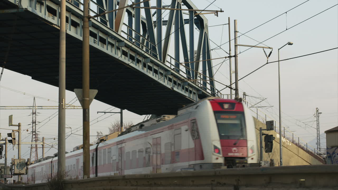 Train crossing the ramps from right to left under the bridge pan right movement