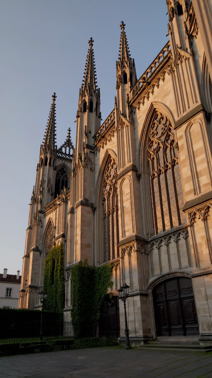 A majestic cathedral facade captured at a low angle, showcasing Gothic architecture