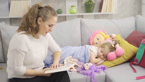 the mother tells a story to her child and the child falls asleep.