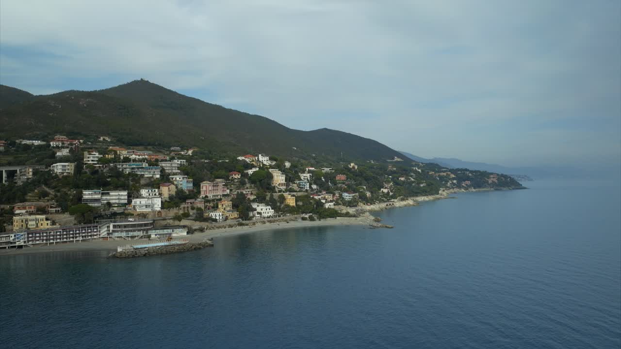 Scenic aerial view of the seaside village comune of Varazze, Liguria with pristine ocean waters and idyllic mountains