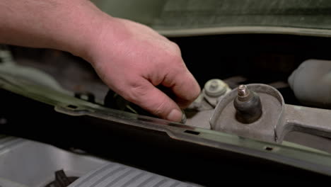 car mechanic replacing car at repair service station