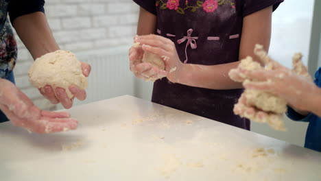 Mom-cooking-with-kids.-Family-cooking-cake-dough-together