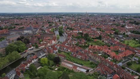 Aerial-shot-of-Bruges-in-Belgium-overlooking-the-city-center-and-it's-churches