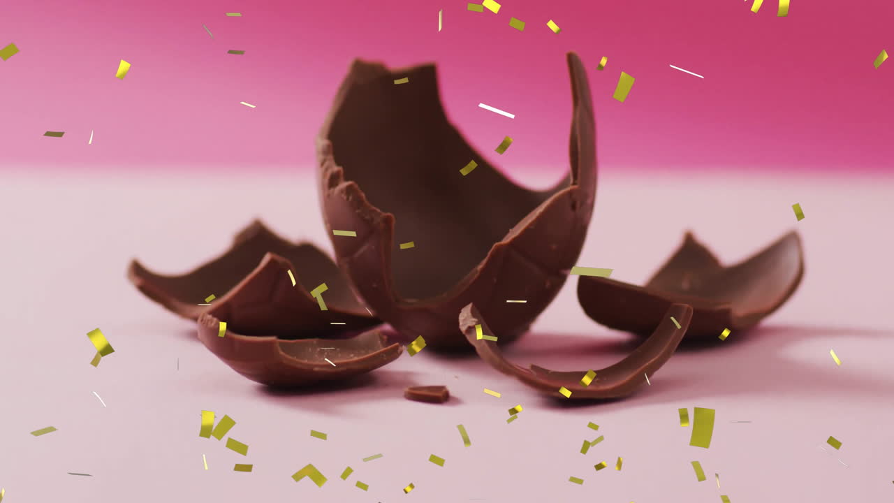 animación de confeti cayendo sobre el chocolate sobre un fondo rosado