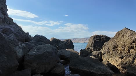 experience the tranquility of crimea's unique coastline, where rocky formations meet the gentle waves under a clear blue sky