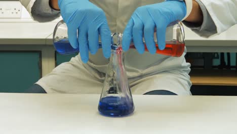 scientist doing chemical experiment