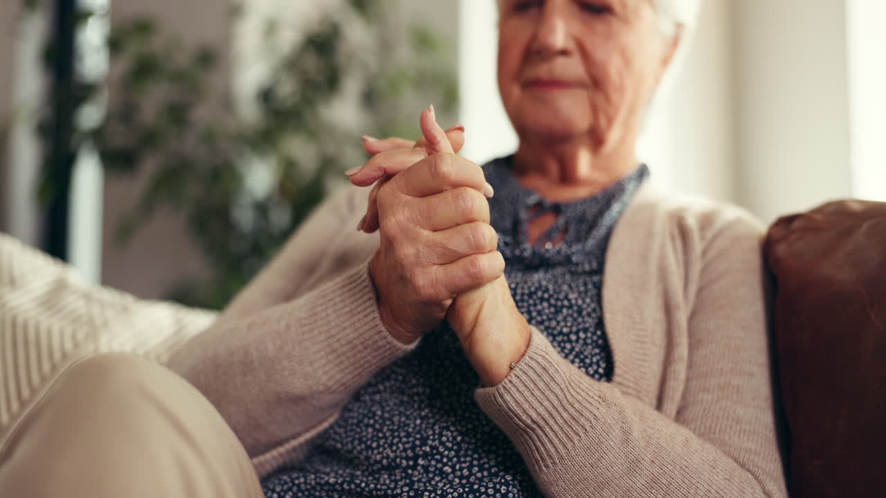 Elderly woman suffering from joint pain and arthritis