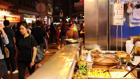 crowded market with diverse street food stalls