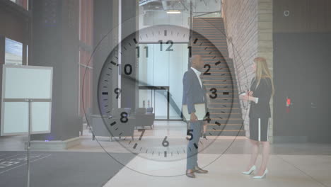 animation of clock moving over diverse colleagues talking at work