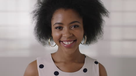 close up portrait of beautiful young african american woman smiling happy successful black female afro hairstyle stylish look