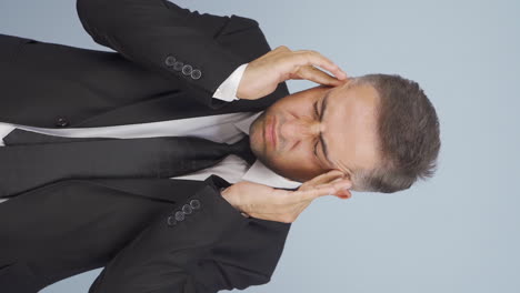 Vertical-video-of-Businessman-with-headache.